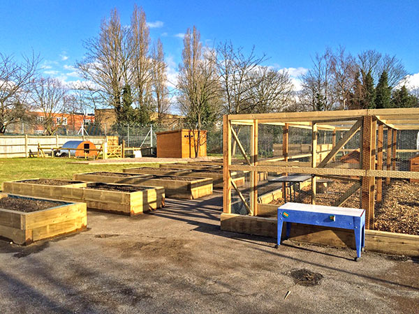 School farm showing Grow and learn, pig and hen houses