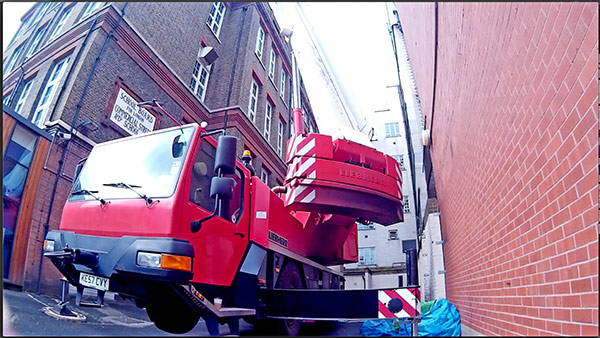 Crane used to lift equipment in place to create 5th floor roof garden